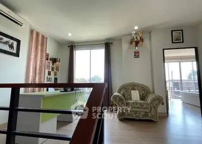 Spacious living room with elegant armchair and natural light