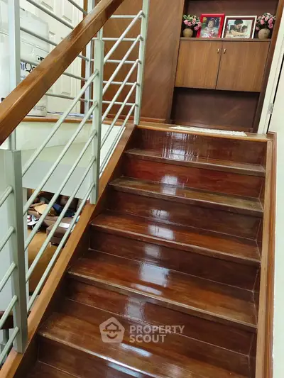 Elegant wooden staircase with sleek railing in modern home interior