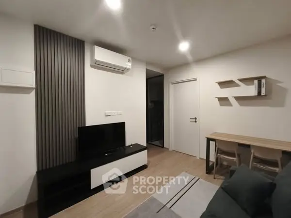 Modern living room with sleek furniture and air conditioning
