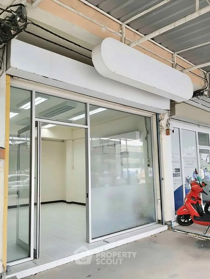 Spacious commercial property with glass facade and ample natural light, ideal for retail or office space.