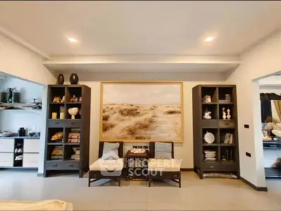 Elegant living room with modern decor and built-in shelving, perfect for stylish living.