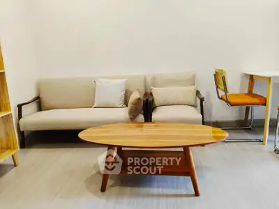 Modern living room with stylish furniture and wooden coffee table