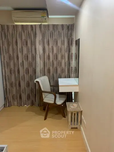 Cozy study nook with elegant chair and wall-mounted desk in a serene room setting.
