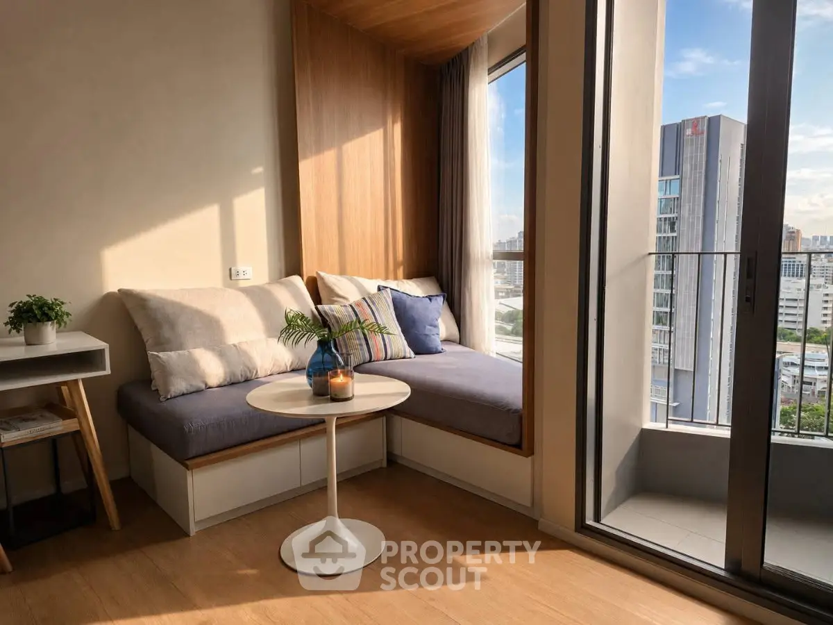 Cozy living room with a sunlit reading nook and city view balcony, perfect for relaxation and enjoying urban scenery.