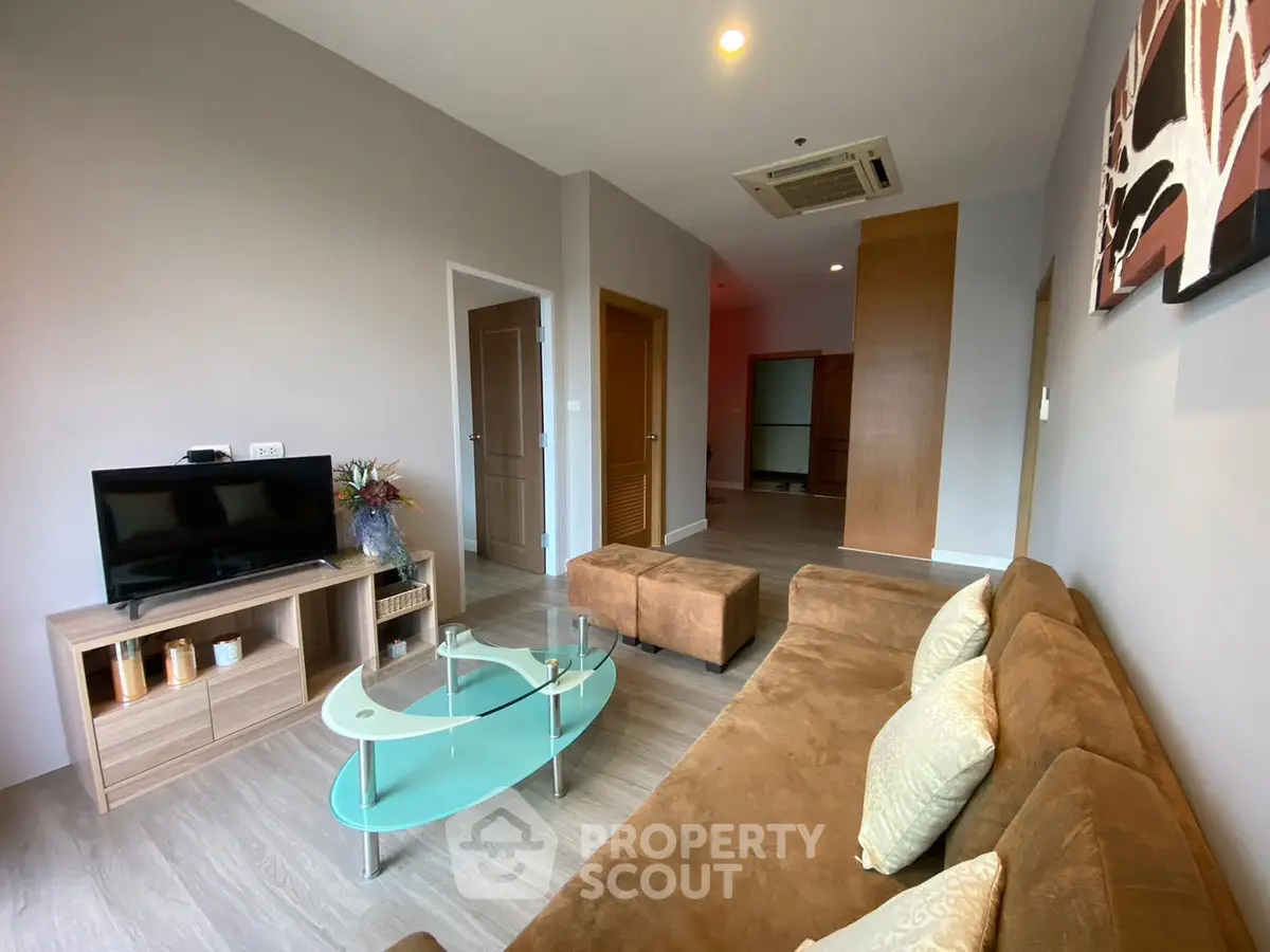 Modern living room with stylish furniture and contemporary decor in a spacious apartment.