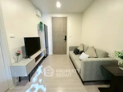 Modern living room with sleek furniture and stylish decor in a cozy apartment.