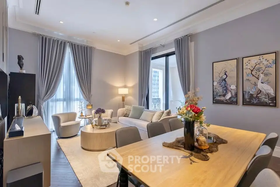 Elegant living room with modern decor and large windows in a luxury apartment.