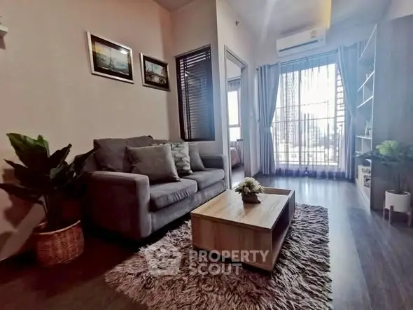 Stylish living room with cozy sofa and large window view