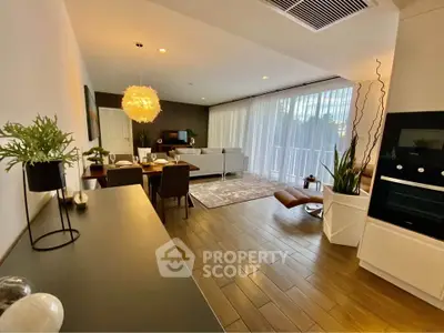 Spacious modern living room with elegant decor and large windows