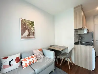 Cozy living room with modern kitchenette and stylish decor