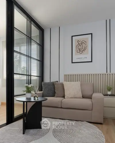 Stylish living room with modern decor and cozy seating area, perfect for relaxation.