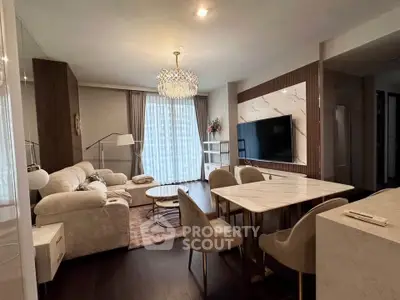 Luxurious living room with elegant chandelier and modern furnishings