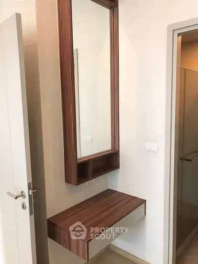 Modern minimalist bathroom with wooden vanity and mirror