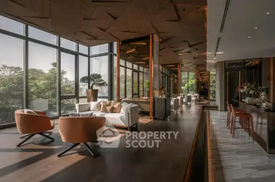 Luxurious modern living room with floor-to-ceiling windows and elegant decor.
