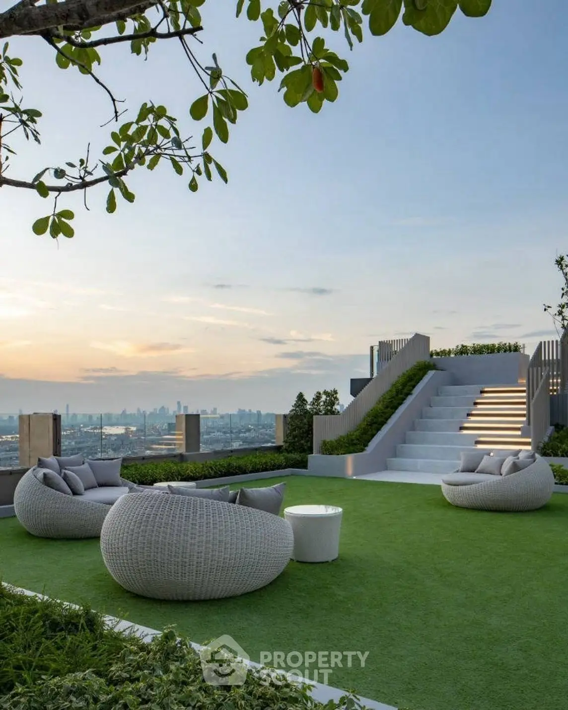 Luxurious rooftop garden with modern seating and stunning city view at sunset.