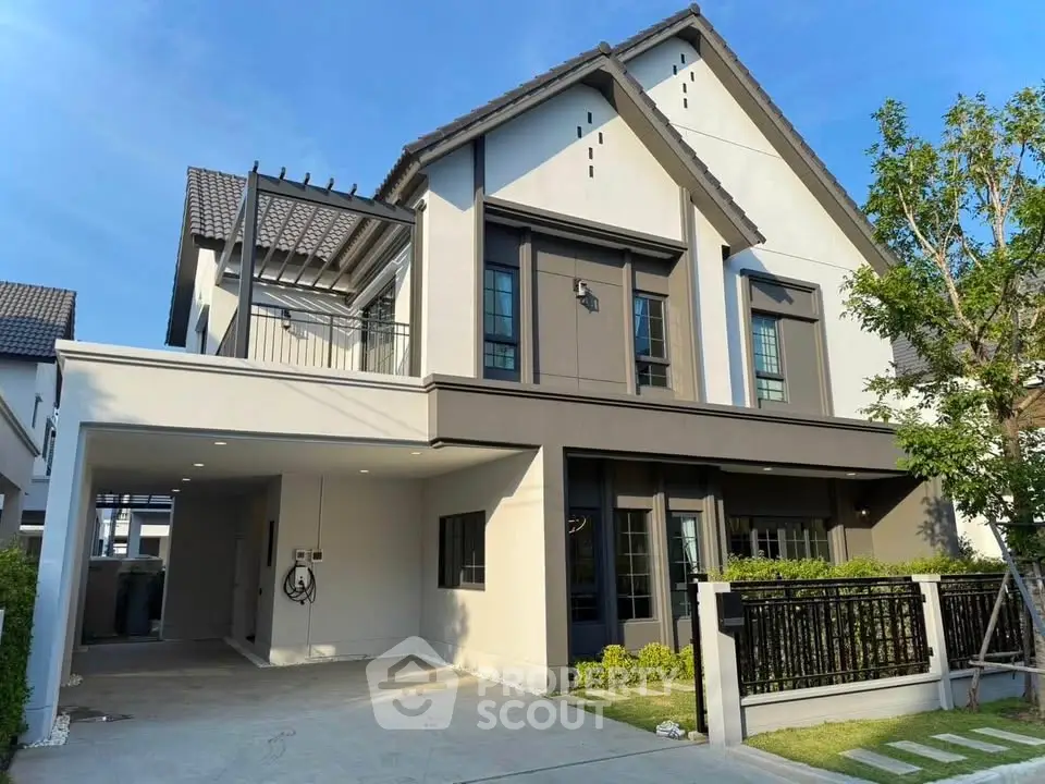 Modern two-story house with elegant facade and spacious driveway in a serene neighborhood.