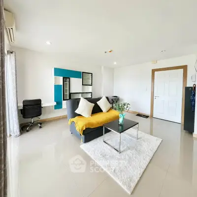 Spacious modern living room with sleek furniture and natural light
