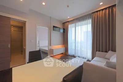 Modern living room with elegant decor and large window view