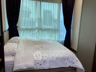 Cozy bedroom with city view and stylish curtains