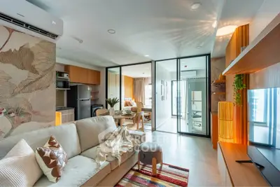 Modern open-plan living room with stylish decor and natural light
