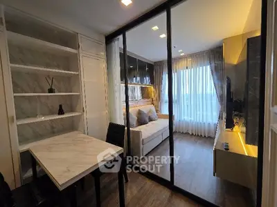 Modern living room with glass partition and elegant decor