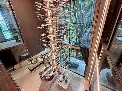 Luxurious modern living room with high ceilings and elegant decor