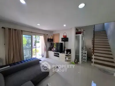 Spacious living room with modern decor and natural light