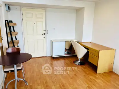 Chic study room with modern furniture and wooden flooring, perfect for productivity and style.
