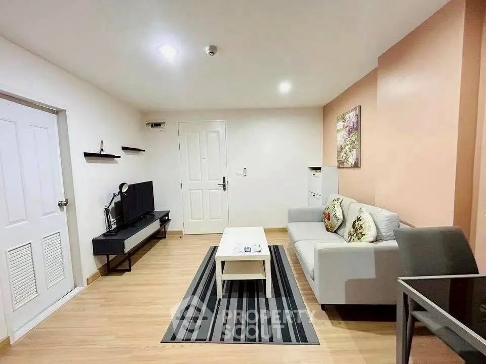 Modern living room with stylish decor and cozy seating area, perfect for relaxation and entertainment.