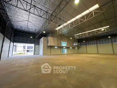 Spacious industrial warehouse with high ceilings and ample natural light