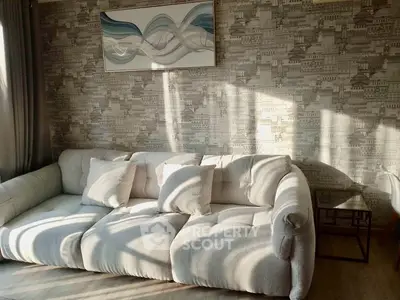 Stylish living room with modern sofa and artistic wall decor