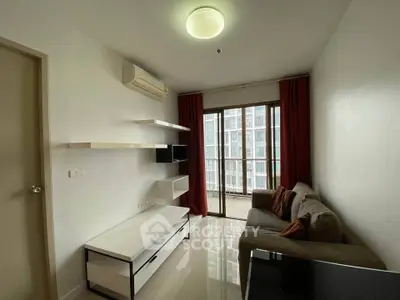 Modern living room with sleek furniture and large window view