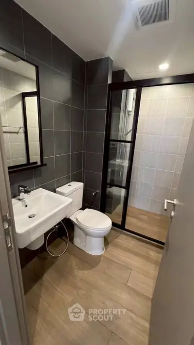 Modern bathroom with sleek design and glass shower enclosure