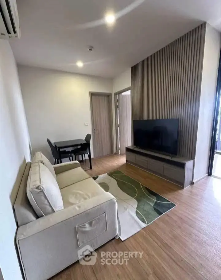 Modern living room with stylish decor and wooden flooring