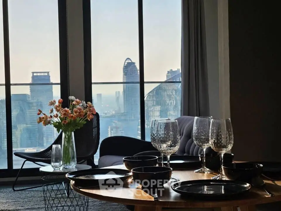 Luxurious living room with stunning city view, elegant decor, and modern furnishings for sophisticated urban living.