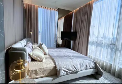 Luxurious bedroom with floor-to-ceiling windows and city view