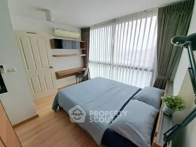 Modern bedroom with large window and stylish decor