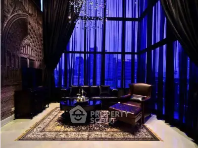 Luxurious living room with elegant decor and stunning city view through floor-to-ceiling windows.