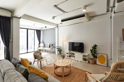 Spacious modern living room with stylish decor and natural light