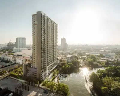 Stunning high-rise building with panoramic city and river views, perfect for urban living.