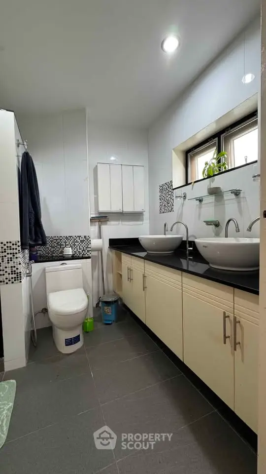 Modern bathroom with dual sinks and sleek design