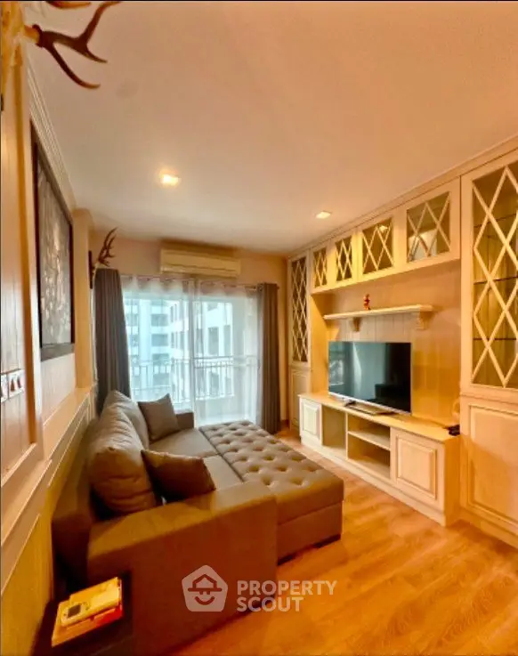 Charming living room with cozy sofa and elegant built-in cabinetry, perfect for relaxation.