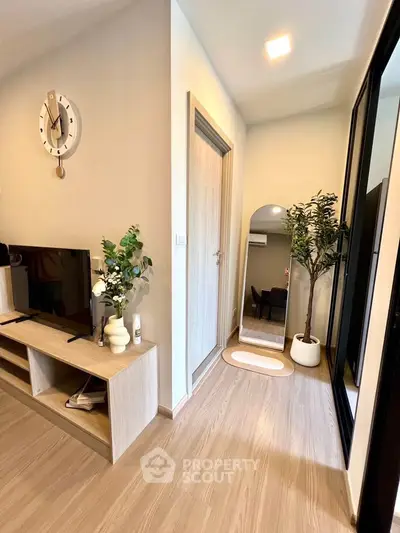 Modern living room with stylish decor and wooden flooring