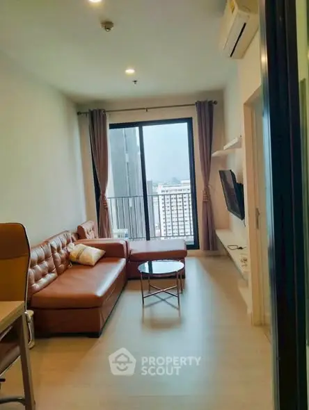 Modern living room with leather sofa and city view balcony