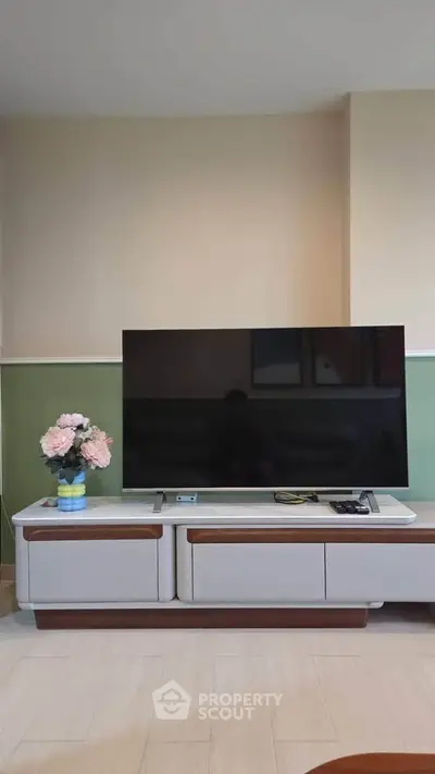 Modern living room with sleek TV stand and elegant decor