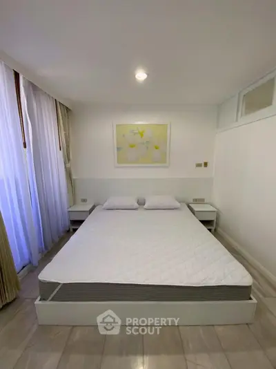 Modern minimalist bedroom with large window and stylish decor