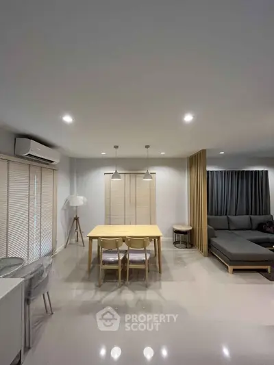 Modern living room with sleek furniture and ambient lighting