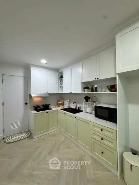 Modern kitchen with sleek cabinetry and appliances in a bright, inviting space.