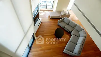 Spacious modern living room with elegant furniture and large windows