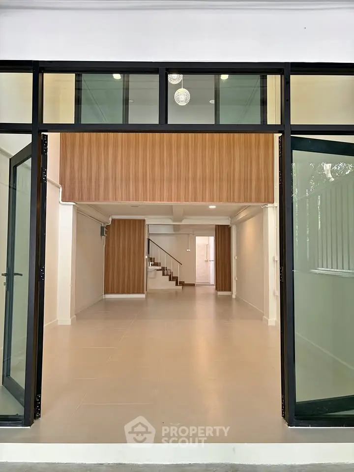 Spacious modern interior with open layout and elegant wooden accents, perfect for contemporary living.